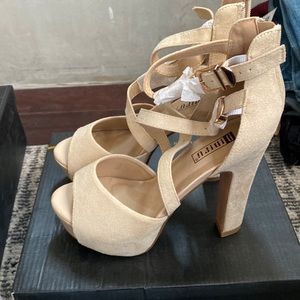 Nude strappy heeled sandals
